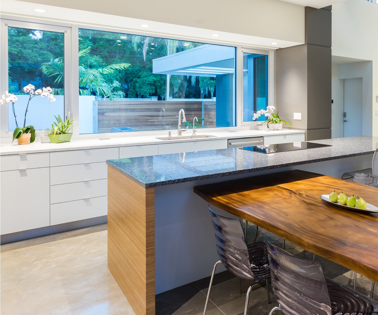 Bright kitchen with impact replacement windows from Naples Windows, a Mighty Fine Company™
